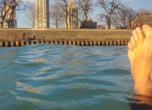 Floating with an open water swim buoy and wetsuit
